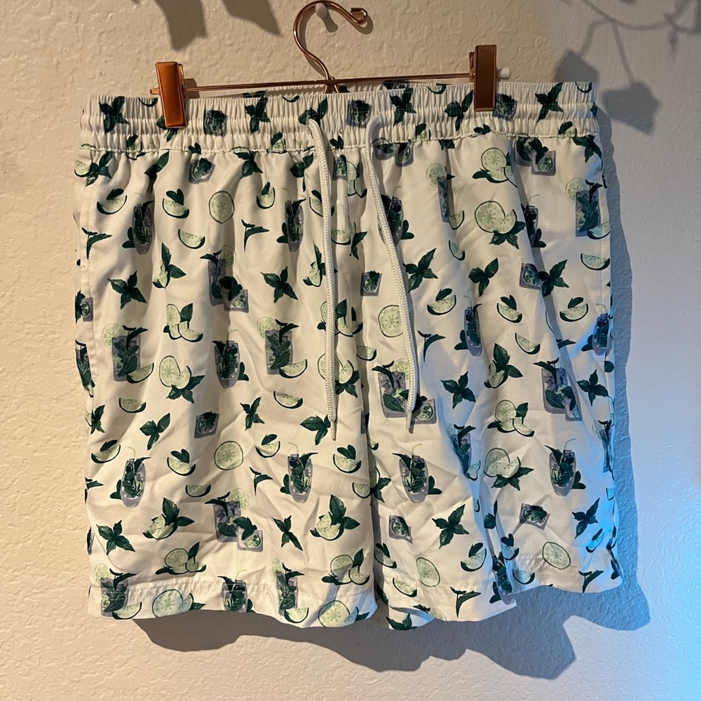 Drink pattern swim trunks—> L